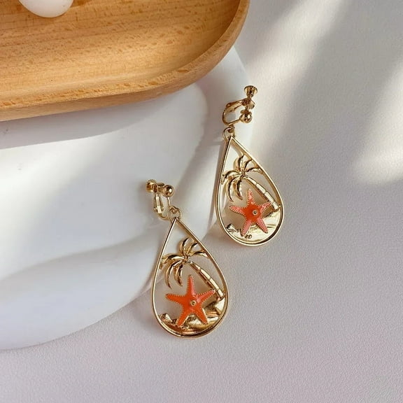 Clip on 2 1/4" gold and orange starfish dangle teardrop earrings