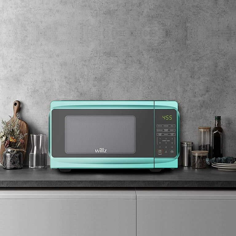 This Compact Microwave Oven is perfect for small spaces and comes with six  pre-programmed settings: popcorn, potatoes, frozen vegetables…