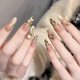 thumbnail image 1 of Autumn-themed, luxurious, handcrafted French manicure with shimmering 3D heart-shaped rhinestones and pearl plaid pattern. 10 pieces, size XS (tool kit included). JHA358 - Golden Brown Leopard Print., 1 of 5
