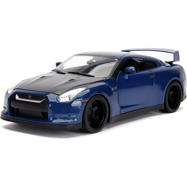  Nissan GT-R (R3) azul metalizado y carbono con luces y figura de Brian \Fast