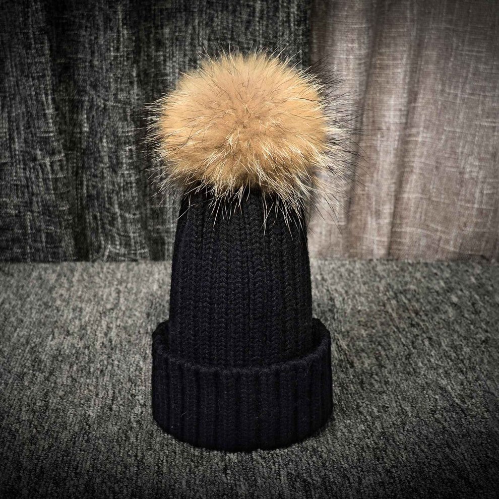 cap with fur ball on top