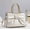 f199Off-White, variant on Women's Glossy Khaki Patent Leather Tote Bag with Bow & Rhinestone Detail, Gold-Tone Braided Handles, Convertible Crossbody Strap