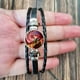 thumbnail image 4 of Pulsera con póster de Sally Face para hombre y mujer, brazalete de cuero ajustable con figura de juego de dibujos animados, Cosplay, novedad, 4 of 5