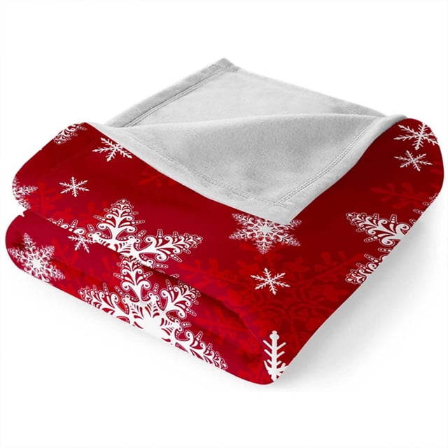 Manta navideña con copos de nieve rojos, suave y cálida, ideal para sofá, cama, camping y festivales.