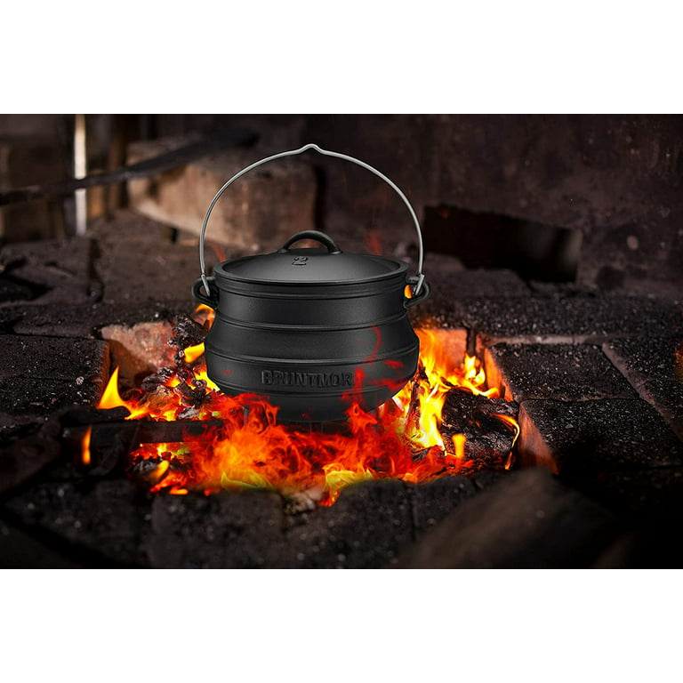 Cauldron or Camping Kettle Over Open Fire Outdoors Stock Image