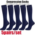 thumbnail image 1 of pares de calcetines de compresión hasta la rodilla para hombres y mujeres, 1 of 8