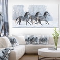 thumbnail image 1 of Herd of Horses Run Across Snow, 1 of 3