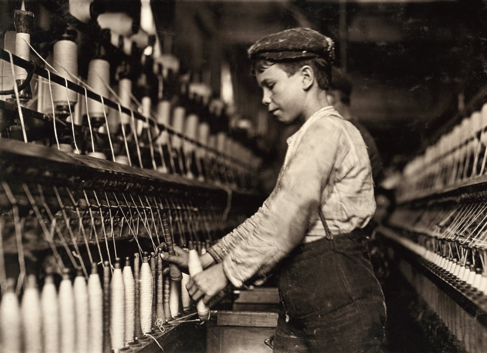 Hine Child Labor, 1909. /Na Young Doffer Working In The Globe Cotton