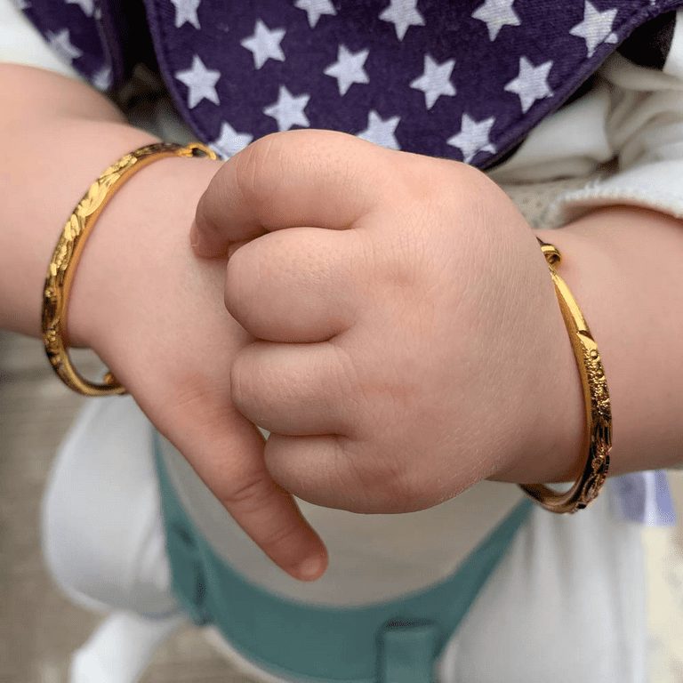 Boys hand deals bangle