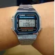 thumbnail image 3 of Reloj pulsera digital Casio A-168 con correa de acero inoxidable color plateado - fondo gris/negro/azul, 3 of 6