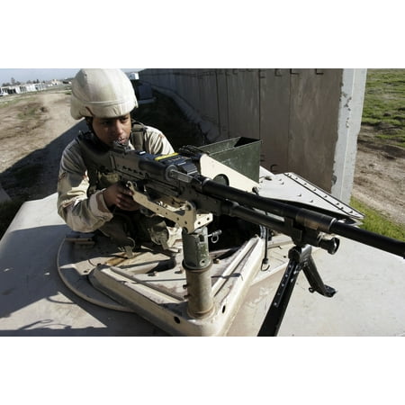 US Air Force Airman aims a M240B machine gun Canvas Art - Stocktrek Images (34 x