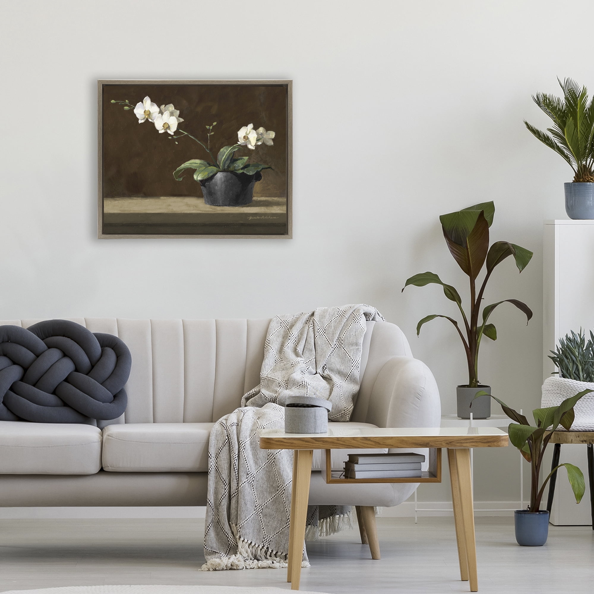 Stupell Industries Potted White Orchid on Ledge Brown Framed Floater Canvas Wall Art, design by Yumiko Ichikawa