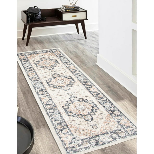 ECARPET Heriza traditional runner rug featuring intricate floral and geometric designs in beige, gray, and blue hues laid out on a wood floor in a modern hallway setting.
