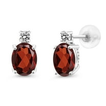 Gem Stone King 14k White Gold Red Garnet and White Diamond Earrings for Women (2.53Cttw, GemstoneJanuary Birthstone, Oval 8X6MM, Round 2.5MM)
