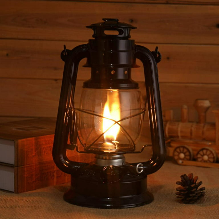 A Old Rustic Oil Lantern On A Wood Block At A Camping Site Stock