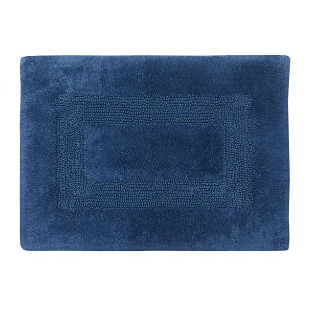 Navy blue cotton bath rug featuring a textured racetrack pattern, measuring 17 by 24 inches.