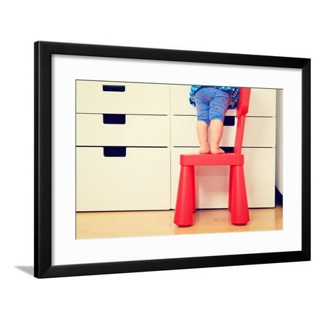 Childrens Climbing Frames - Kids Safety Concept- Little Girl Climbing on Baby Chair Framed Print Wall Art By NadyaEugene
