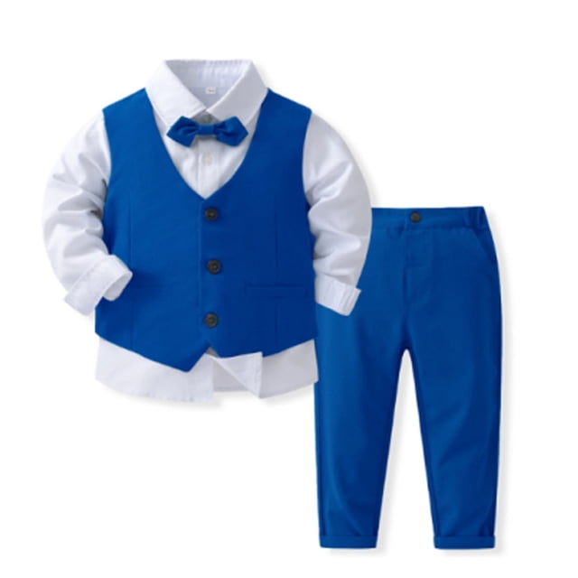 conjunto de camisa de manga larga con cuello vuelto para niños, color liso, para banquetes y fiestas, con cuello vuelto y pantalones de traje, conjunto de tres piezas para niños, poliéster. Vista frontal centrada: camisa blanca de manga larga con cuello vuelto y puños, chaleco azul sin mangas con tres botones oscuros y pajarita azul a juego; pantalones de traje azules con dobladillo y cintura con botón; tejido liso visible sobre fondo blanco. Adecuado para banquetes, fiestas o uso formal; también suele utilizarse para sesiones de fotos infantiles.