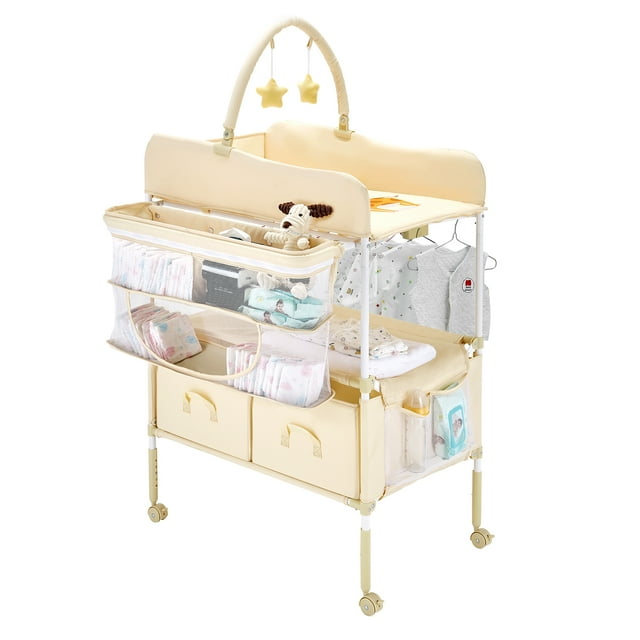 Cambiador de bebe VEVOR, plegable, con 2 cajones de tela, cesta lateral y barra para colgar, altura ajustable, ruedas bloqueables y 2 juguetes en forma de estrella, beige claro.