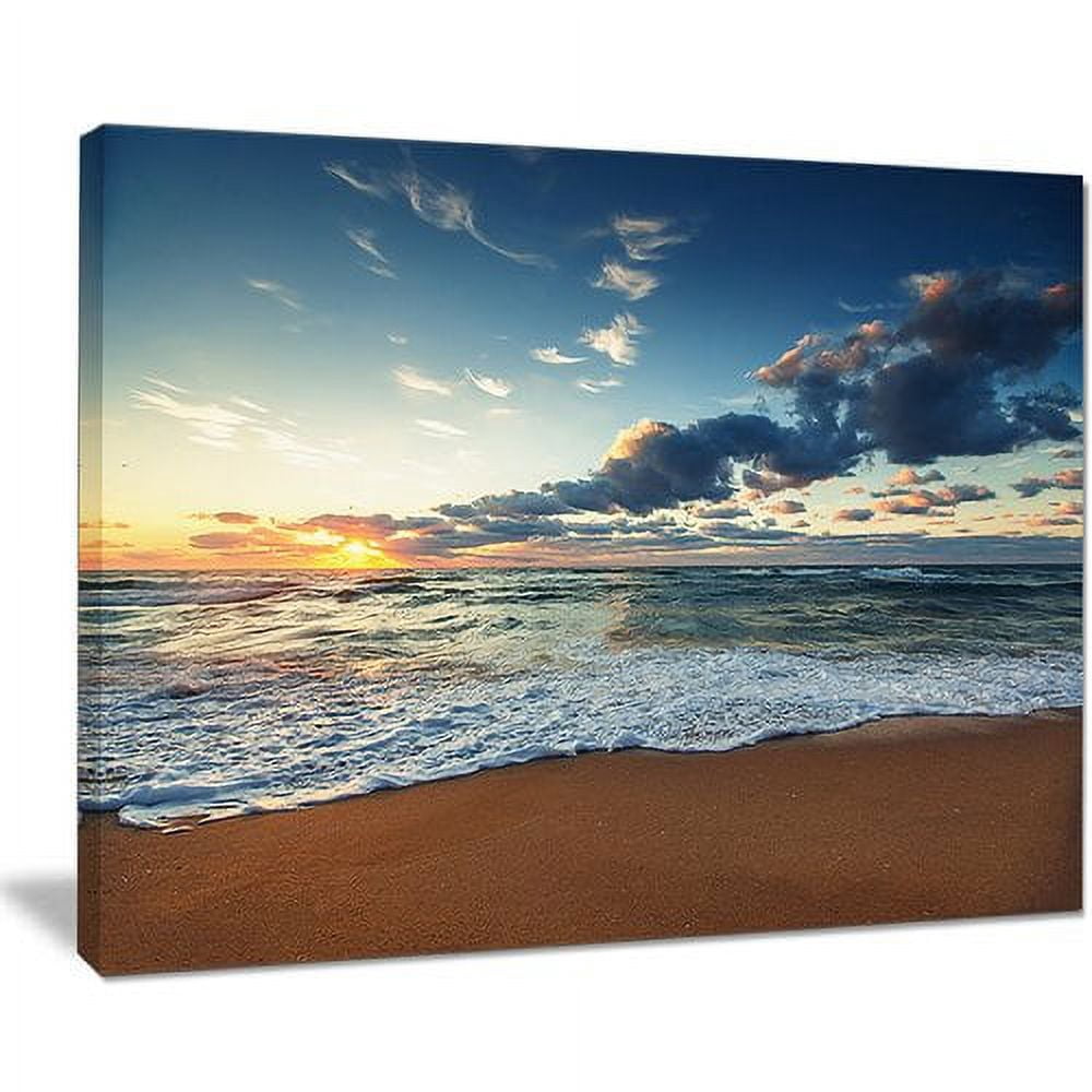 Designart 'Sunrise and Glowing Waves in Ocean ' Seascape Canvas Art Print