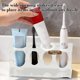 thumbnail image 5 of Estante para baño con diseño de 4 orificios para cepillos de dientes, pasta dental, rastrillos y utensilios, organizador de plástico impermeable para encimera, negro o blanco., 5 of 6