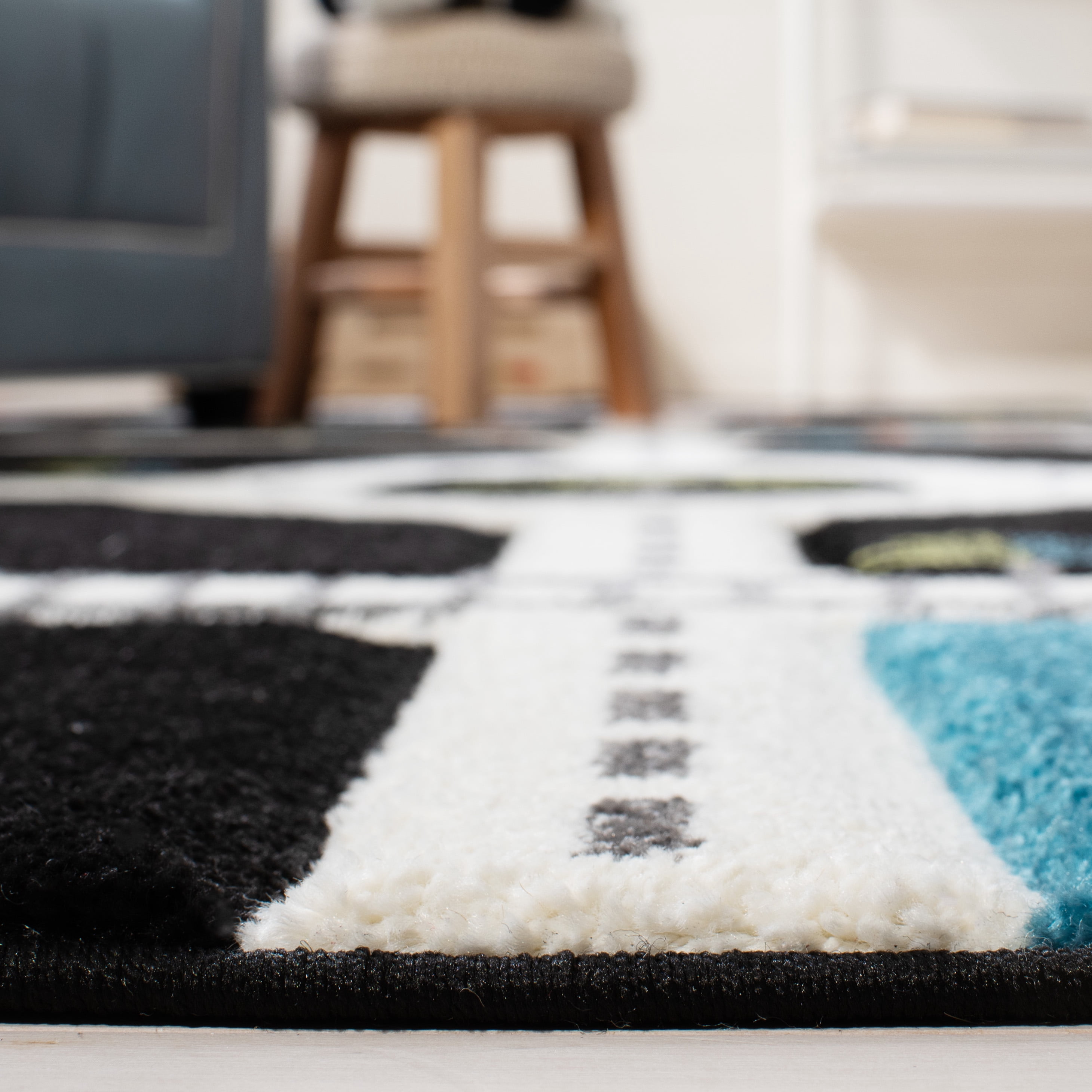 SAFAVIEH Carousel Kids Devan Train Track Area Rug, Black/Ivory, 6'7" x 6'7" Round