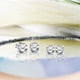 thumbnail image 3 of Pendientes con Solitario de Moissanita JeenMata Talla Cojín 2 Quilates Baño Oro Blanco 18 K sobre Plata, 3 of 8