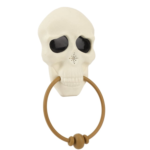 timbre aterrador, cabeza de calavera de pvc duradera con pilas para timbre de halloween para decoración anggrek otros Timbre aterrador de calavera en PVC, vista frontal centrada; ojos negros hundidos, orificio de altavoz en la nariz y anillo marrón sostenido entre los dientes. Dimensiones aprox. 29 x 13 cm; funciona con 3 pilas AAA (1,5 V) no incluidas. Ideal para decoración de Halloween en casa, bares o salas de escape; también suele usarse como accesorio de puerta en fiestas.