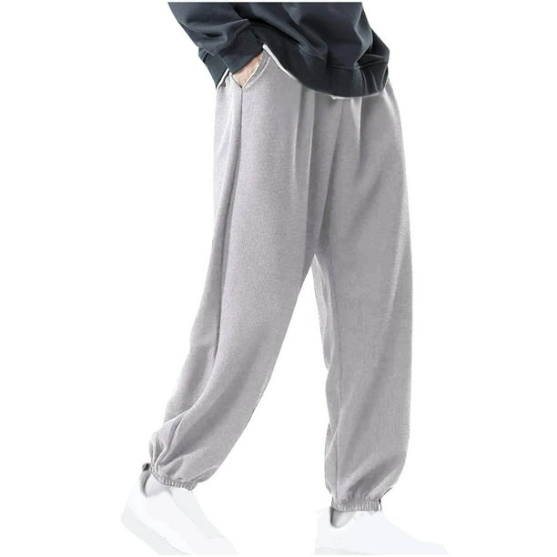 Pantalones largos de moda para hombre, casuales, de color sólido, con cintura elástica y bolsillos, pantalones largos de poliéster para hombre.
