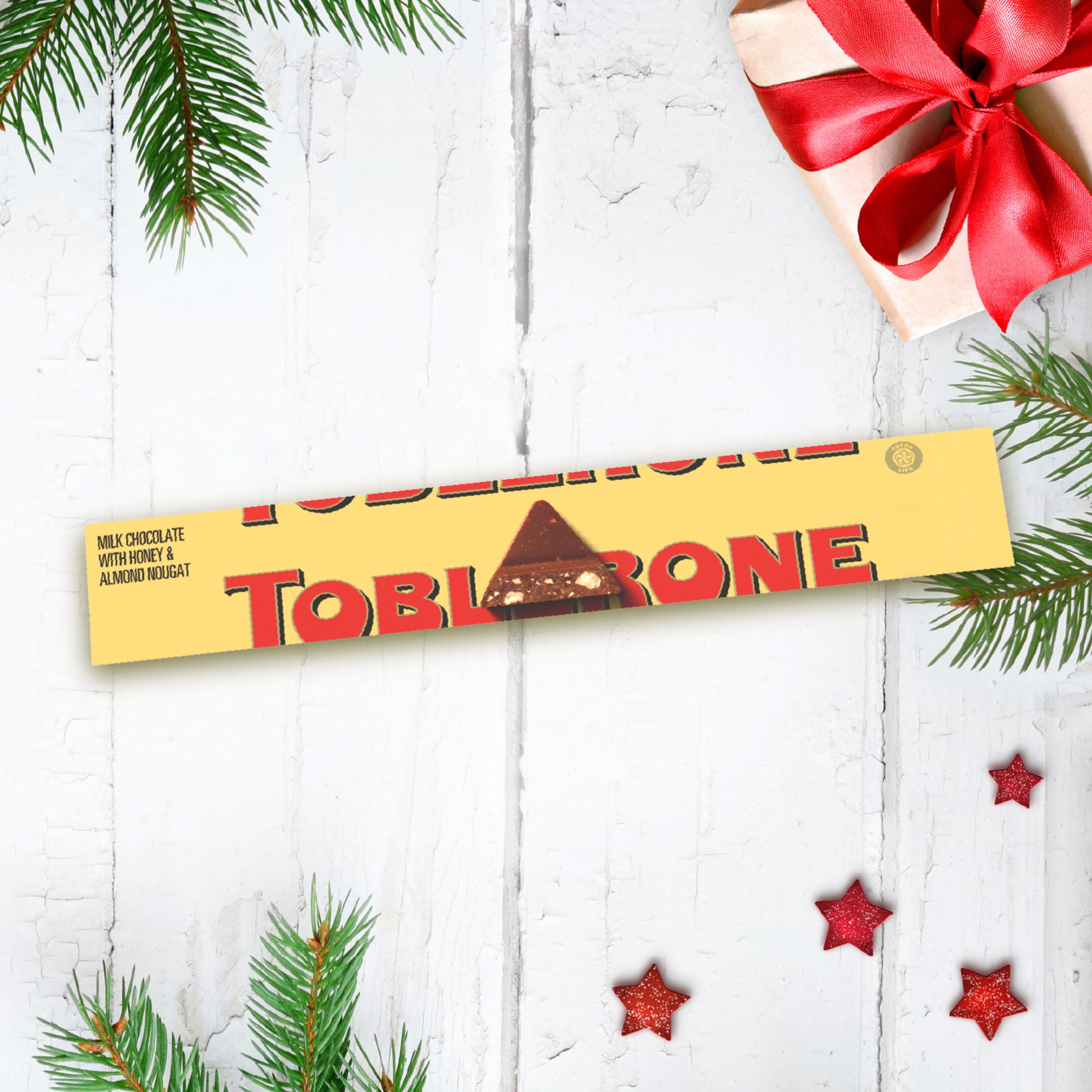 Tablette de chocolat au lait TOBLERONE avec nougat au miel et aux amandes 100 g