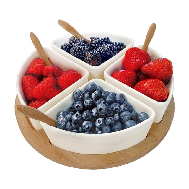 JS Gourmet Appetizer Serving Set with a bamboo tray and four triangular ceramic bowls, each filled with fresh berries, accompanied by four wooden spoons. The eco-friendly bamboo tray measures 22 x 22 x 1.2cm, and the bowls are 9.5 x 9.5 x 5cm, perfect for serving hors d'oeuvres, dips, and sauces at gatherings.
