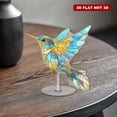thumbnail image 6 of Rotating acrylic ornament featuring a stunning stained glass hummingbird with vibrant colors and elegant gold foil details on a white background, 6 of 8