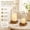 Gold, variant on Glass Hurricane Candle Holders Set of 2, Decorative Gold Pillar Lanterns with Hanging Metal Frame, Modern Table Centerpieces, Antique Brass Finish