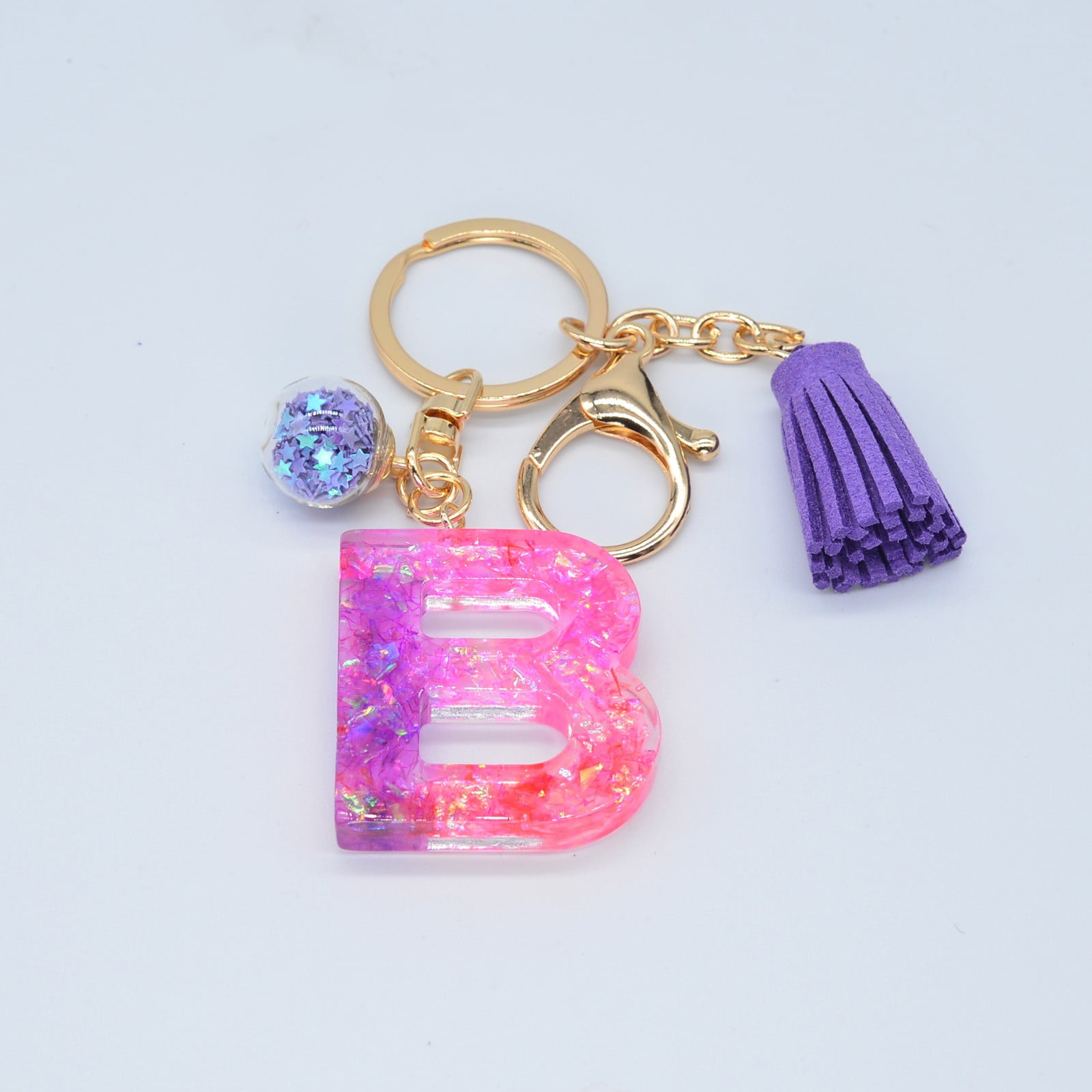 Crafty Angel Art F - Letter - Initial Resin Keychain Translucent Letter F with Sea Shells Inside It and Purple Party Glitter on The Front with A Beaded Charm and A Paw