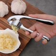 thumbnail image 2 of Premium Kitchen Garlic Press with Soft, Easy-Squeeze Handle - Includes Silicone Garlic Peeler and Cleaning Brush - 3 Garlic Mincing Tools - Sturdy, Ea, 2 of 4