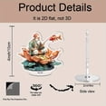 thumbnail image 2 of Rotating acrylic ornament featuring an old man in colorful attire fishing from a lotus with a jumping red carp against a white background, 2 of 8