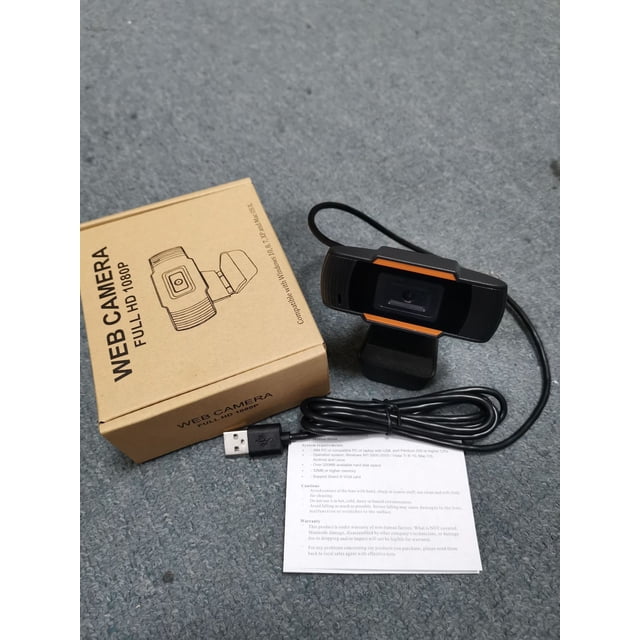 cámara usb para enseñanza en red spot drive-free 1080p 720p 480p cámara web para computadora en vivo Cámara web Heldig, vista frontal centrada en soporte de pinza; carcasa negra con detalles naranjas, lente y sensor CMOS visibles, cable USB A enrollado, manual y caja marrón marcada "WEB CAMERA FULL HD 1080P"; adecuada para videoconferencias y lecciones en línea.