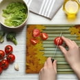 thumbnail image 3 of Fall Cutting Board, Fallen Leaves on Wooden Wall September Foliage Rustic Style Print, Decorative Tempered Glass Cutting and Serving Board, Large Size, Pale Coffee Marigold, by Ambesonne, 3 of 5