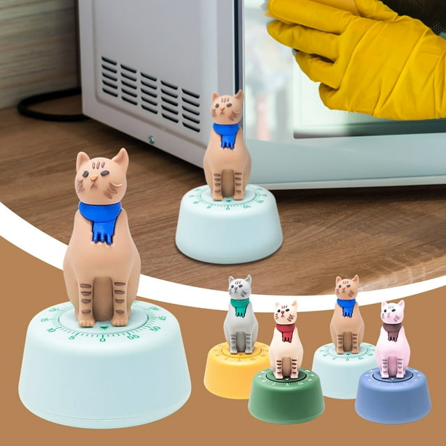 fiudx temporizador mecánico de 60 minutos sin pilas diseño fácil de usar bonitas formas multicolor color azul: temporizador compacto de material ABS con base redondeada marcada en minutos y figura de gato en la parte superior; vista frontal sobre encimera de cocina delante de un microondas. Perfecto para cocina, oficina, juegos de mesa y fiestas; suele utilizarse también para cronometrar turnos en juegos de mesa.