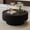 Black + Leather + Tempered Glass + Round, variant on Luckynote 31.5" Fluted Round Storage Coffee Table - Tempered Glass Top & Premium Leather Wrapped, Modern Black Coffee Table with Hidden Storage for Living Room