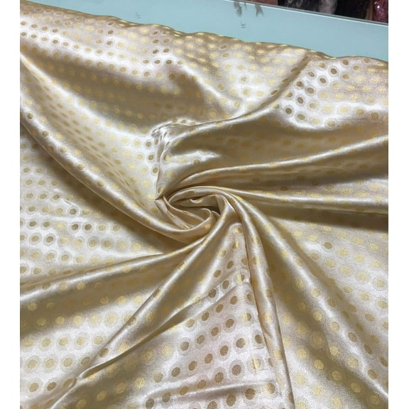 Beautiful vintage polka dot gold brocade 44” wide. Best used for home decor and apparel. Sold by the yard