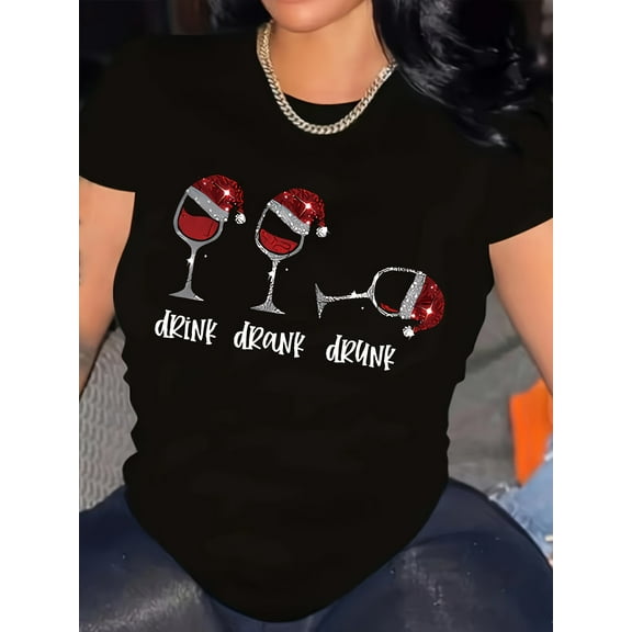 Plus Size Women's Christmas Glitter Cup Graphic T-Shirt ,Christmas top with printed patterns of small snowflakes, reindeer antlers, and Christmas hats