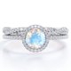 thumbnail image 1 of JeenMata Anillo Nupcial con Diseño Infinito de Piedra Lunar Azul de 1,75 ct y Pavé de Moissanita con Engaste de Halo de 4 Puntas, en Baño de Oro Blanco de 18 K sobre Plata, 1 of 6