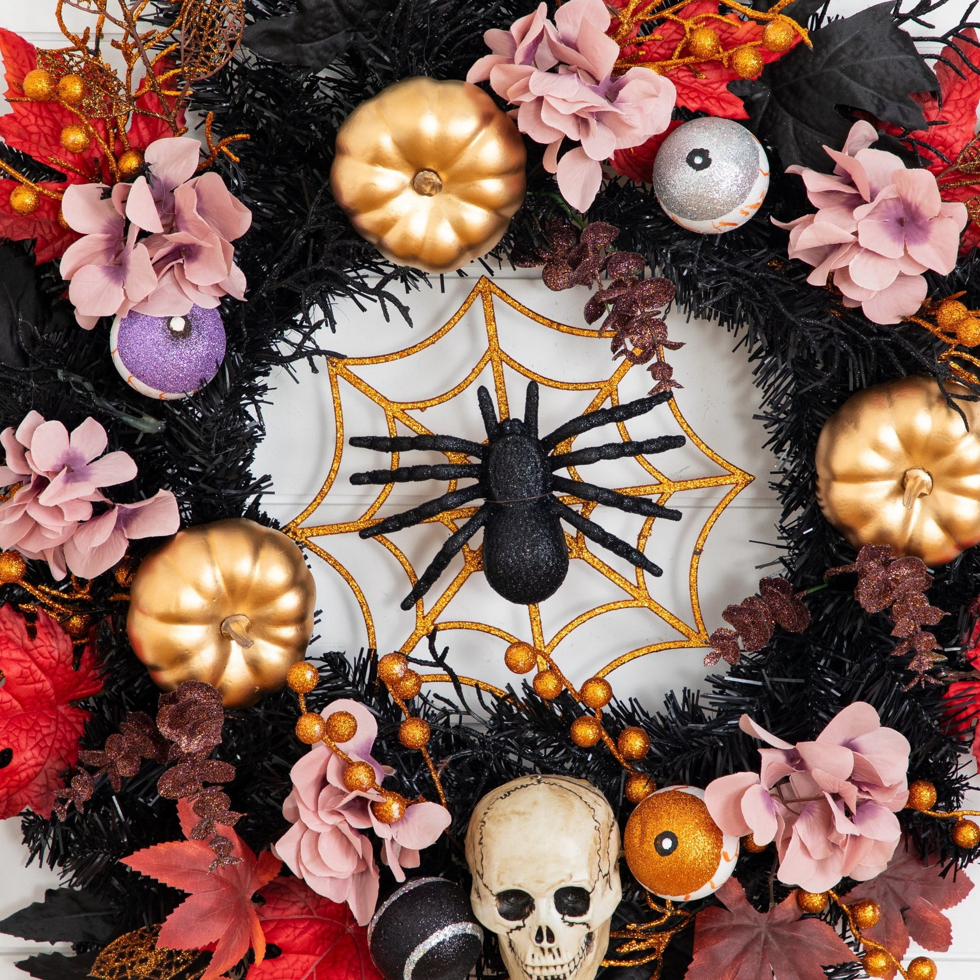 24in. Artificial Halloween Wreath with Skulls, Spiders and Pumpkins