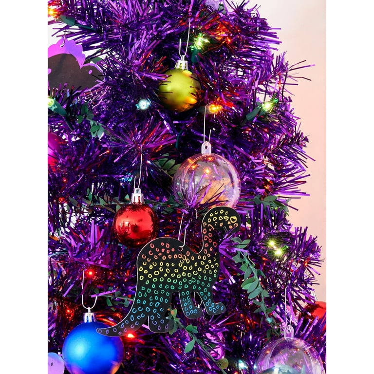 Modern purple christmas trees with ornaments and lights outdoor. Stylish  Christmas street decor Stock Photo by Sonyachny