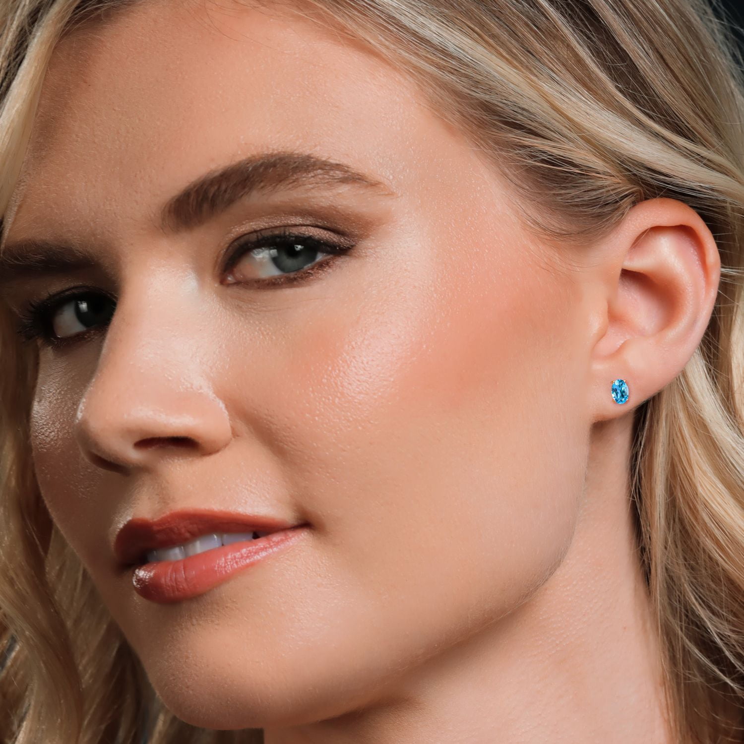Gem Stone King 10K Yellow Gold Swiss Blue Topaz Stud Earrings for Women Men (1.10 Cttw, Gemstone November Birthstone, Oval 6X4MM)