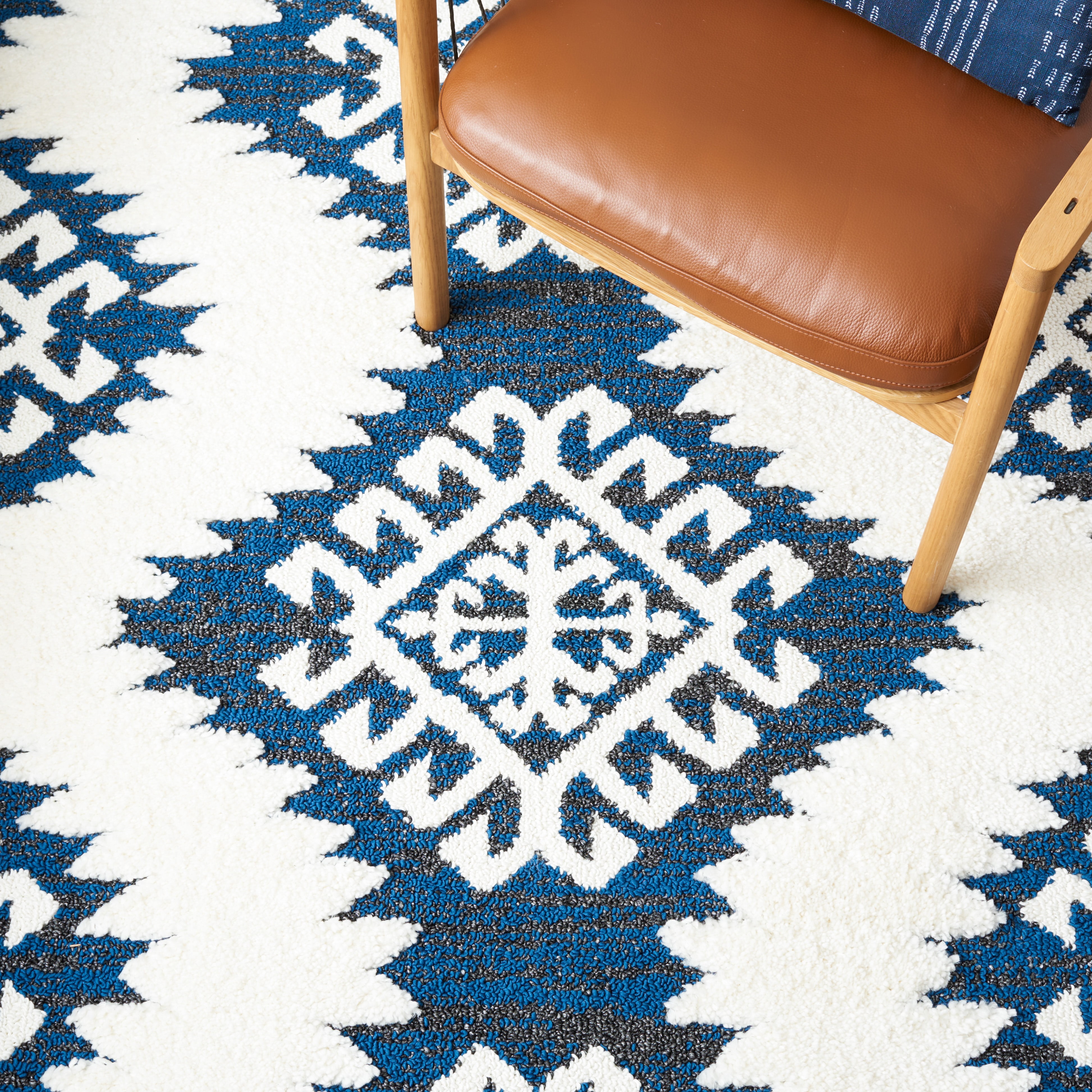 SAFAVIEH Moroccan Tassel Desmond Southwestern Shag Area Rug, Navy/Ivory, 10' x 14'