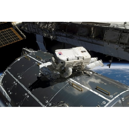 - Astronaut works on the new Columbus laboratory during a spacewalk The astronaut worked to replace a nitrogen tank used to pressurize the stations ammonia cooling system Poster Print