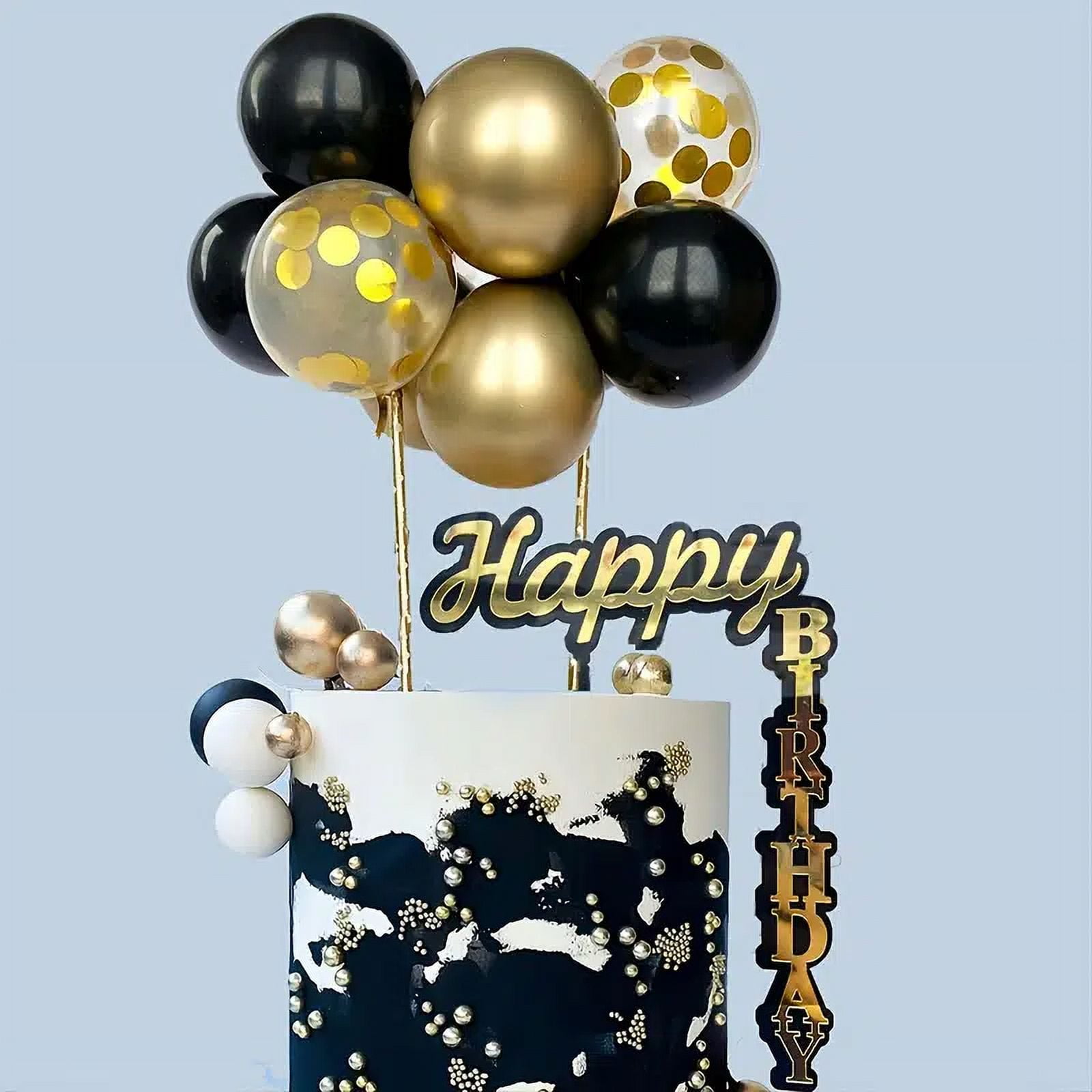 Premium AI Image  A cake with black and gold decorations and a gold cake  with black and gold balloons on top.