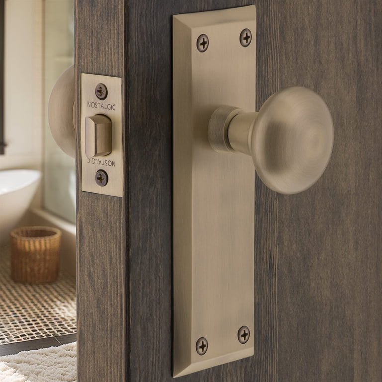 Nostalgic Warehouse New York Plate With Crystal Knob - Antique Brass Passage Door Set, 2.75" Backset, Solid Forged Brass